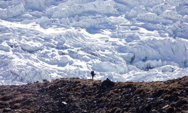 A Life Happens Outdoors hiker in front of a beautiful glacier during the Everest Base Camp Trek