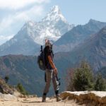 A hiker enjoying the view of Ama Dablam in the Khumbu Valley during the Life Happens Outdoors Everest Base Camp Trek