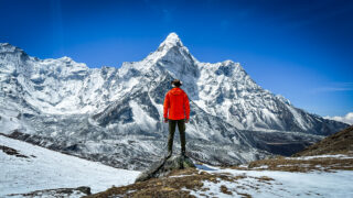 Tony Aoun looking at Ama Dablam from the summit of Chukung Ri during an acclimatization rotation on the Climb Ama Dablam Expedition with the Life Happens Outdoors team.