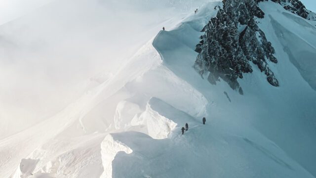 Ascending the moguls on the way to the summit ridge during the Mont Blanc Summit Climb course with the Life Happens Outdoors team.