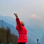 Hened Choueiry stretching in Chomrong before trekking to Dovan on the second morning of the Annapurna Sanctuary trail during the Annapurna Base Camp Trek with the Life Happens Outdoors team.