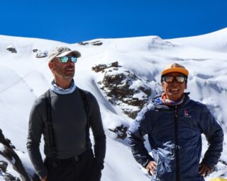 Life Happens Outdoors climber with a Nepalese mountain guide below Mera Peak’s glacier.
