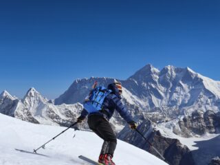 Ski mountaineer descending a snow slope during a Mera Peak ski-touring expedition.