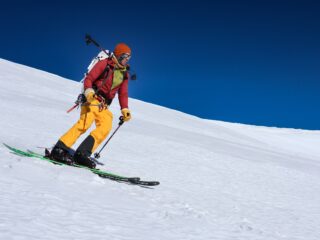Ski mountaineer descending a snow slope during a Mera Peak ski-touring expedition.