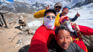 The Life Happens Outdoors team on the top of Renjo La pass with LHO Team Leader Hazem El Shamy, enjoying one of the best views of Mount Everest during the Gokyo Lakes Trek.