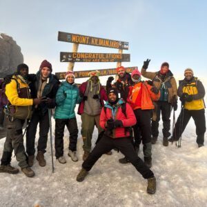 The Life Happens Outdoors team at Stella Point on the way to the Uhuru Peak summit of Mount Kilimanjaro via the Machame Route, led by LHO Team Leader Jean Louis Moukarzel.