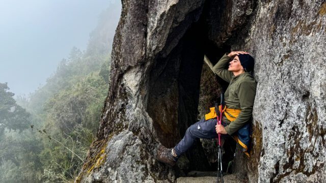 Nasser Al-Naama outside the cave that the trail passes inside of during the third and final day of the trek to the famous UNESCO World Heritage site, Machu Picchu, with the Life Happens Outdoors team.