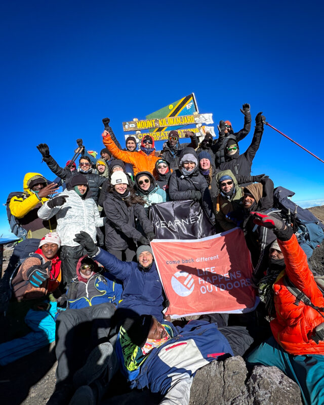 The A.T. Kearney team on the summit of Kilimanjaro during the Climb Kilimanjaro Corporate Challenge with Life Happens Outdoors.