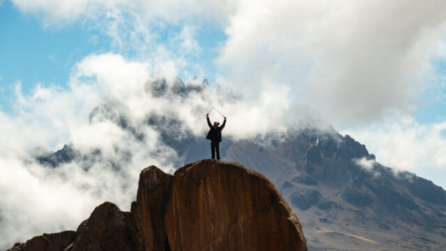 Frederic Sfeir at Kibo Hut on Kilimanjaro with Mawenzi in the background during the Climb Kilimanjaro Expedition with the Life Happens Outdoors team.