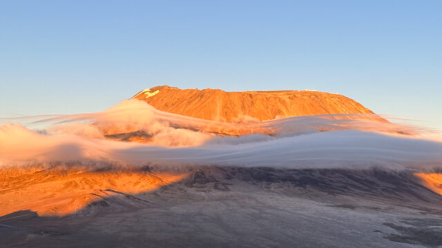 Sunrise on Kibo Crater, the highest point of Kilimanjaro, as seen from Mawenzi, Kilimanjaro's second highest peak, during the Climb Kilimanjaro Expedition with the Life Happens Outdoors team.