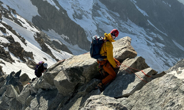 LHO IFMGA Guide Pavlos Tsiantos leading LHOer Farah Moumneh on the Marbrées Traverse during the Mont Blanc Summit Course with the Life Happens Outdoors team.
