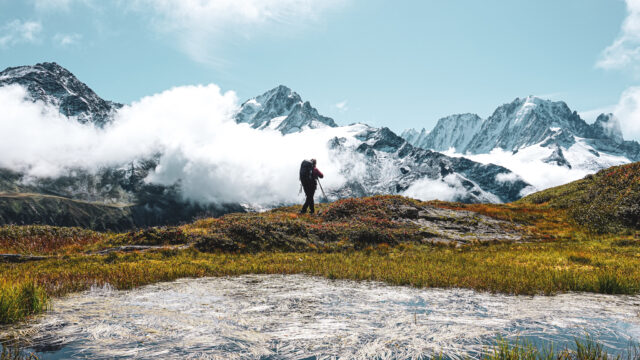 The Life Happens Outdoors team trekking beneath Lac Blanc during the Tour du Mont Blanc (TMB).
