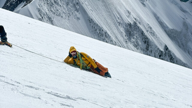 LHO IFMGA guide Pavlos Tsiantos chilling on the Dôme du Goûter during great weather on the way down from the Mont Blanc summit with the Life Happens Outdoors team.