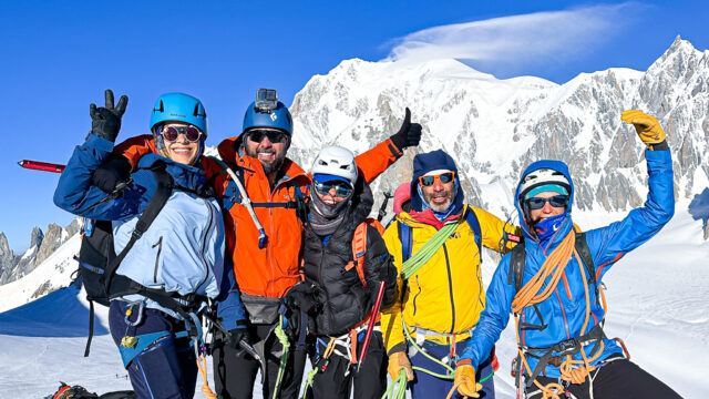 Roberto David, Carla Hachem, and Ranwa Zahr with IFMGA guides Lucia Guichot Martin and Babis Marinidis training on the Vallee Blanche with Mont Blanc in the background during Mont Blanc climbing preparation.