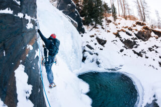 LHOer scaling a waterfall in Cogne during the Ice Climbing in Cogne adventure with the Life Happens Outdoors team.