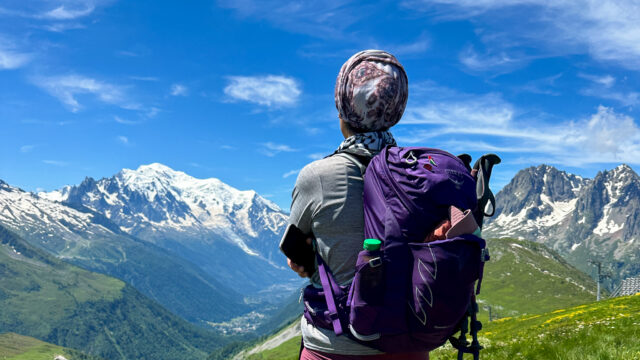 Life Happens Outdoors team member admiring Mont Blanc under clear summer skies during a Chamonix Mont Blanc adventure experience.