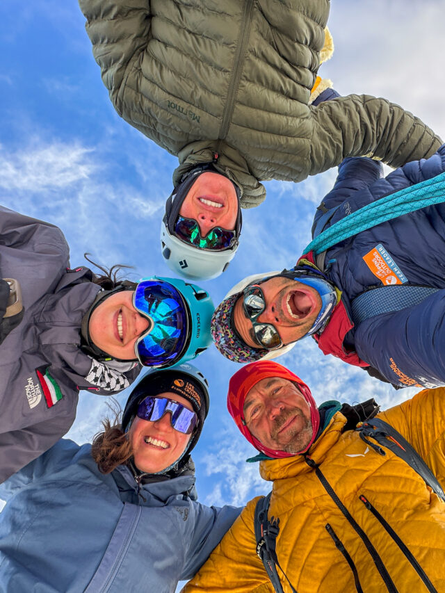 Cover image showing a group of Life Happens Outdoors adventurers celebrating at sunset on a mountain ridge with festive lights, symbolizing the NYE sale.