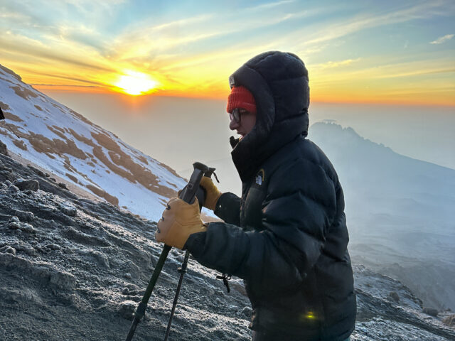 13-year-old Christopher Abboud climbing Mount Kilimanjaro at sunrise just below the summit during Life Happens Outdoors expedition for HALO Trust.