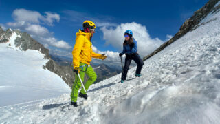 Pavlos, an IFMGA mountain guide with Life Happens Outdoors, teaching the basics of self arrest on the first day of the Mont Blanc Summit Course, part of the article Can I Climb Mont Blanc as a Beginner.