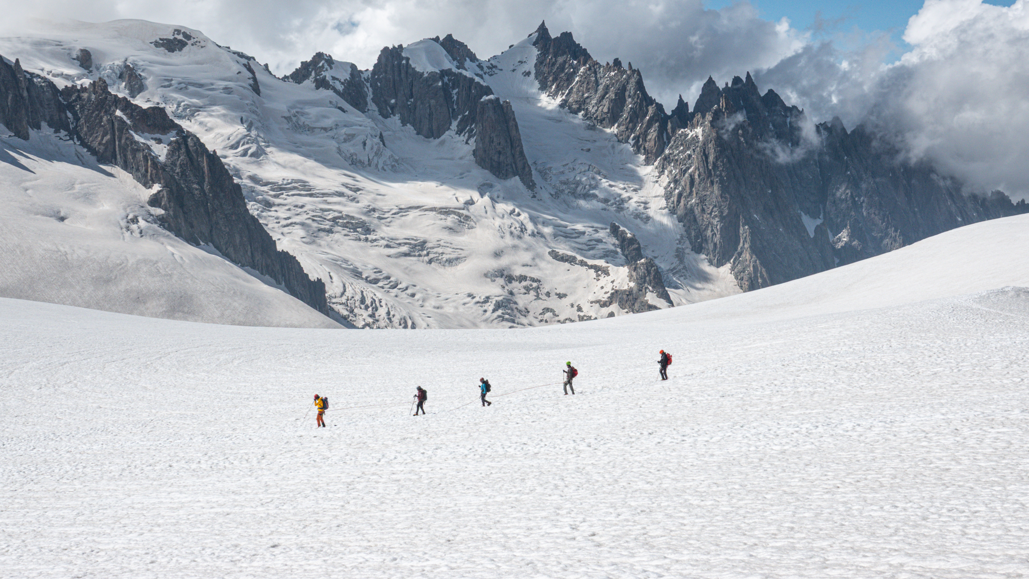 Life Happens Outdoors corporate team roped together on the Vallée Blanche glacier in Chamonix.