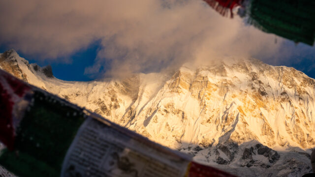 Annapurna Base Camp surrounded by Himalayan peaks at sunrise, showing the location of ABC in Nepal’s Annapurna Sanctuary along the popular trekking route.