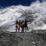 Life Happens Outdoors community members and team leaders posing together at Everest Base Camp on the Nepal trek.