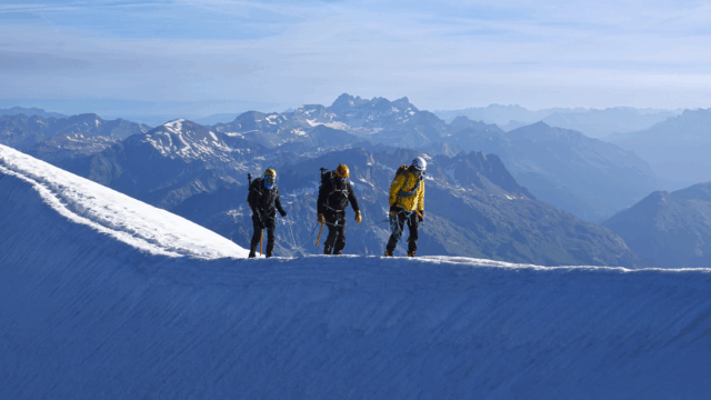Life Happens Outdoors rope team practicing glacier travel skills with ice axes on Mont Blanc, training for a safer Goûter Route ascent on the Mont Blanc Summit Course