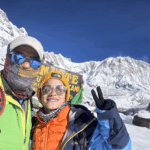 Life Happens Outdoors community members at Annapurna Base Camp with fresh snow and clear blue sky in the Nepal Himalaya