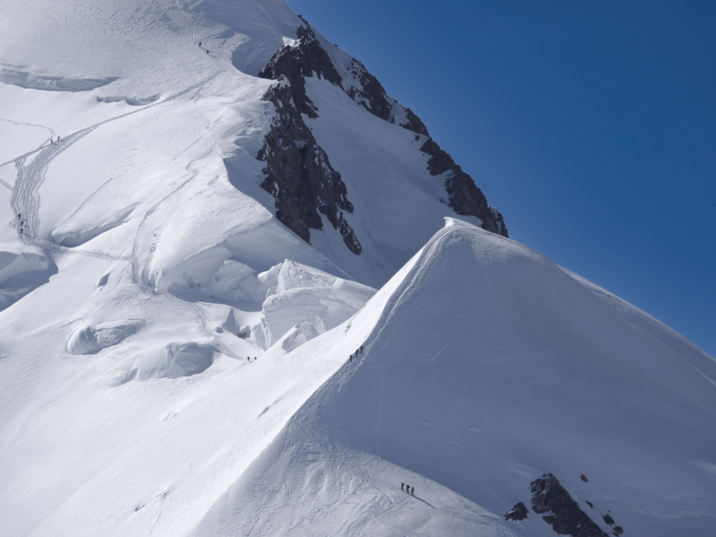 Two Life Happens Outdoors teams climbing the first mogul on the Mont Blanc summit push