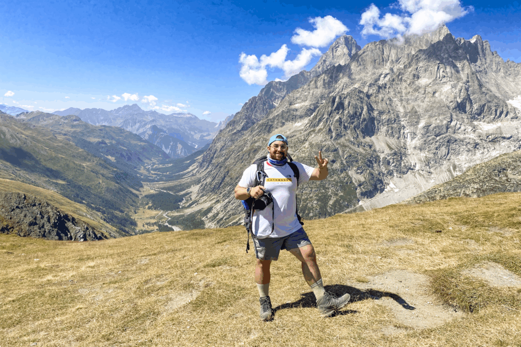 Life Happens Outdoors Team Leader on the Tour du Mont Blanc at Grand Col Ferret on the Switzerland Italy border.