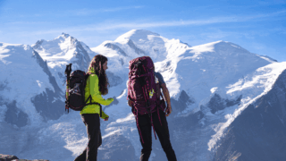 Two Life Happens Outdoors community members sharing a quiet moment with Mont Blanc in view on the Tour du Mont Blanc trek.