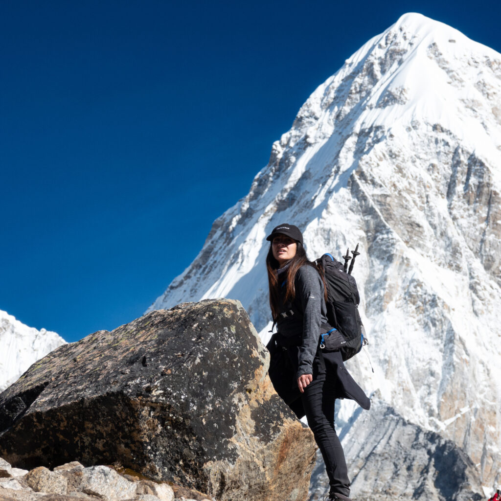 Life Happens Outdoors community member walking toward Everest Base Camp on a high altitude mountain trail