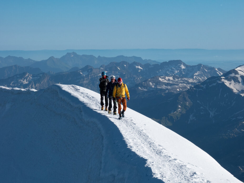 Life Happens Outdoors team crossing the Gouter Ridge on Mont Blanc during a high-altitude climb
