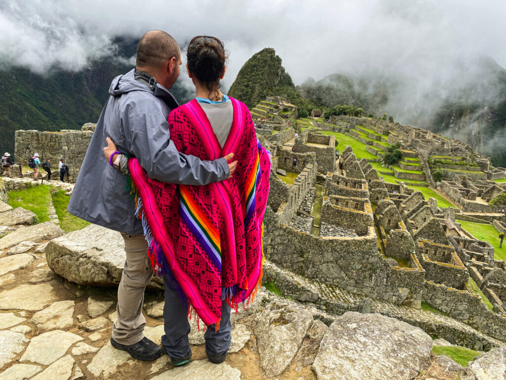 Life Happens Outdoors community member couple looking at Machu Picchu after completing a long trek on the Inca Trail.