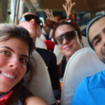 An adult traveller smiling on a mountain trail, rediscovering play, freedom, and exploration with Life Happens Outdoors.