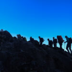 Life Happens Outdoors community members trekking in the early hours toward Lava Tower on the Machame Route on Kilimanjaro