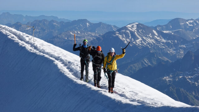 Life Happens Outdoors community members arriving at the Goûter Hut, traversing the Goûter Ridge on Mont Blanc.