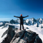 Climber above the Mont Blanc massif with Life Happens Outdoors, capturing overcoming fear through alpine adventure