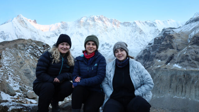 Life Happens Outdoors trekkers in Nepal with snowy Himalayan mountains during the best time to visit Nepal