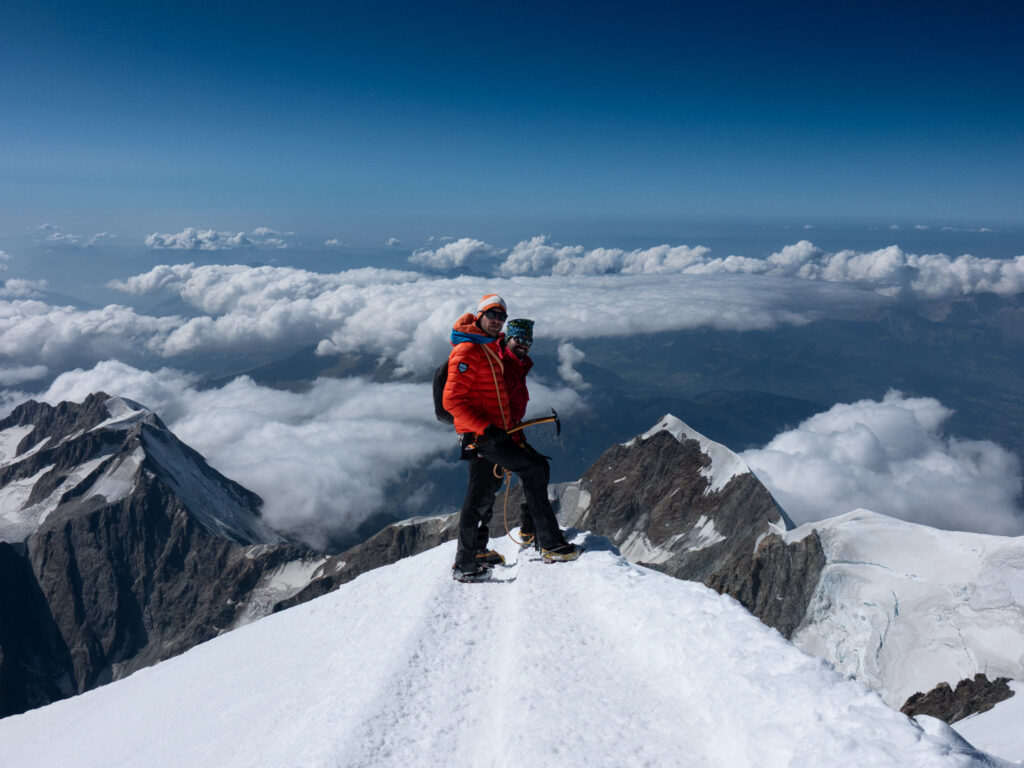 Climbers and guide on the Mont Blanc summit during a guided ascent