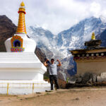 Buddhist stupa on the Everest Base Camp trail with Himalayan peaks in the background in Nepal