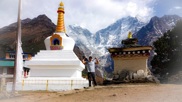 Buddhist stupa on the Everest Base Camp trail with Himalayan peaks in the background in Nepal