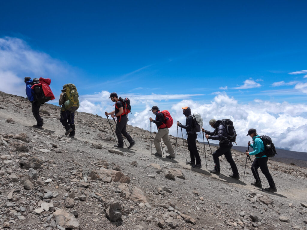 Group of hikers using a slow pole pole pacing strategy on Kilimanjaro