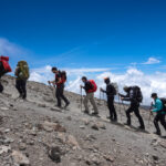 Group of hikers using a slow pole pole pacing strategy on Kilimanjaro