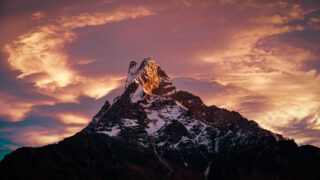 Snow covered mountain peak at sunset for the Life Happens Outdoors Mountains and Peaks guide