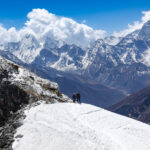 Climbers on a snow covered ridge in the Everest region during a Lobuche East climbing route in Nepal