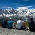 Pioneer Point Partners team sharing a picnic at Brévent overlooking the Mont Blanc massif during their Chamonix offsite.