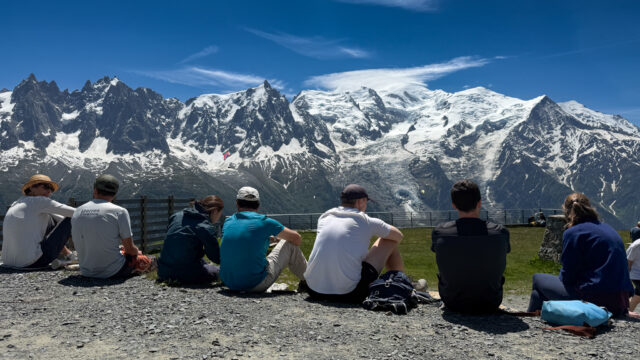 Pioneer Point Partners team sharing a picnic at Brévent overlooking the Mont Blanc massif during their Chamonix offsite.
