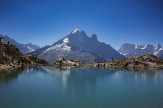 Alpine lake near Chamonix with mountain reflections on a clear summer day