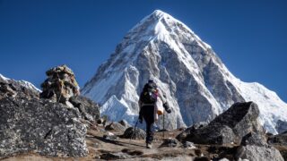 Life Happens Outdoors trekker walking towards Ama Dablam on a high altitude trail in Nepal
